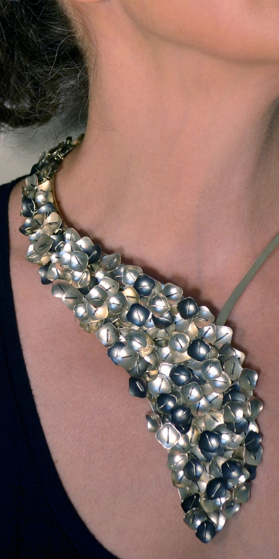 Suzanne Schwartz wearing layered necklace