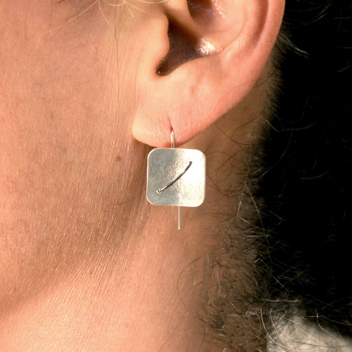 Suzanne Schwartz wearing Square Earring Studs