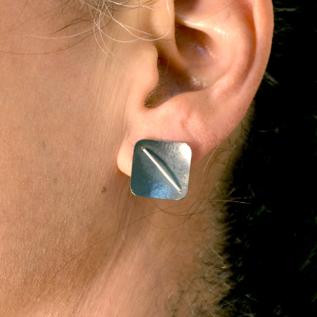 Suzanne Schwartz wearing Square Earring Studs