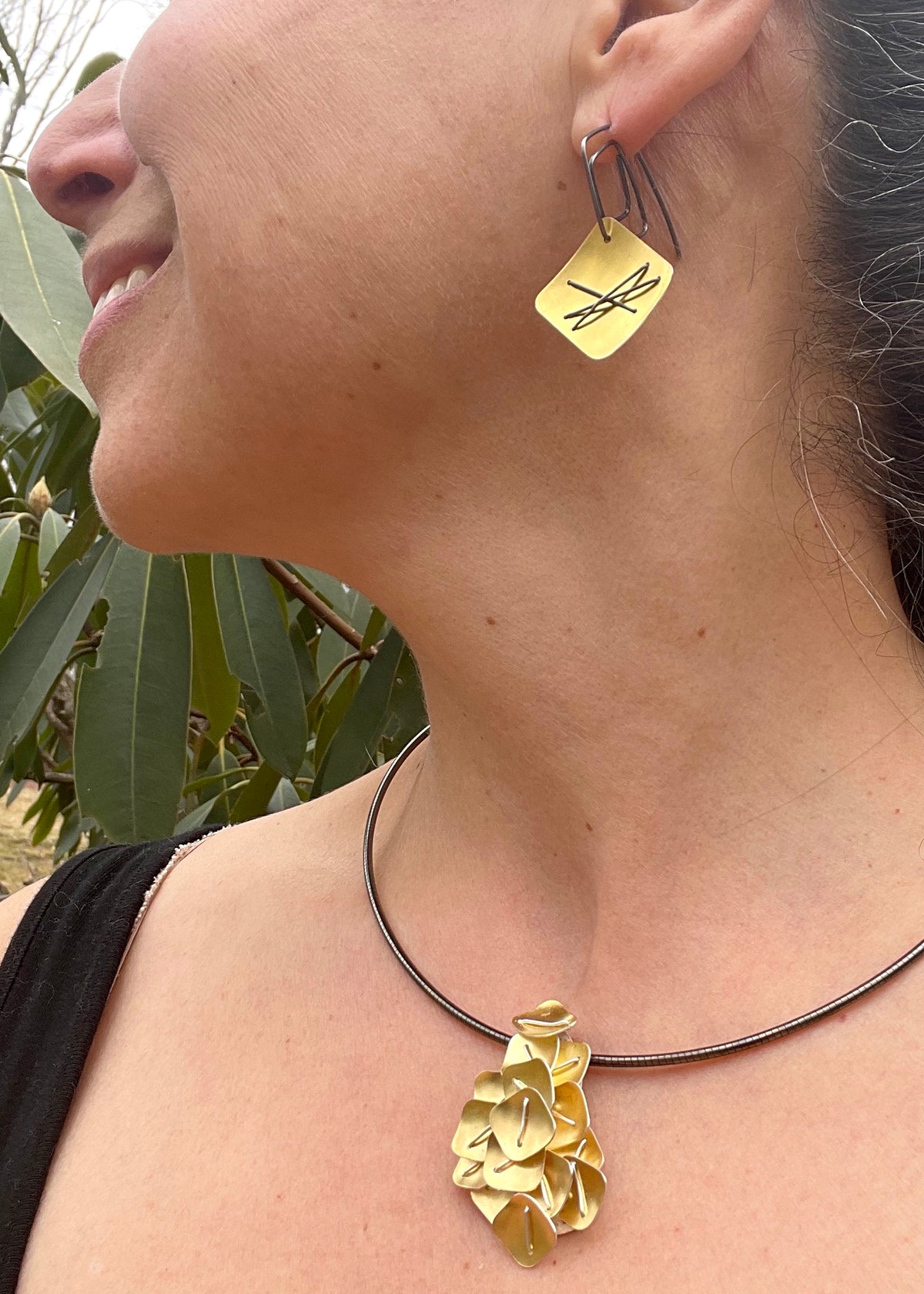 Suzanne Schwartz wearing Three Stitch Hanging Layered Earrings