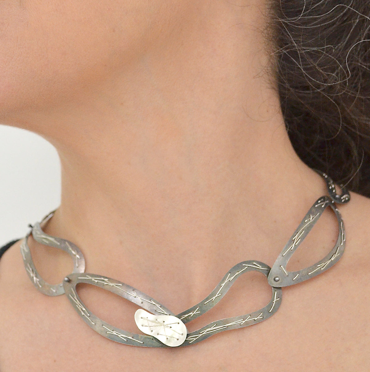 Suzanne Schwartz Wearing Stitched Necklace